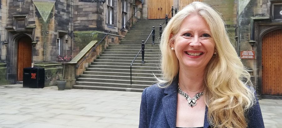 Professor Helen Bond in the quadrangle of New College